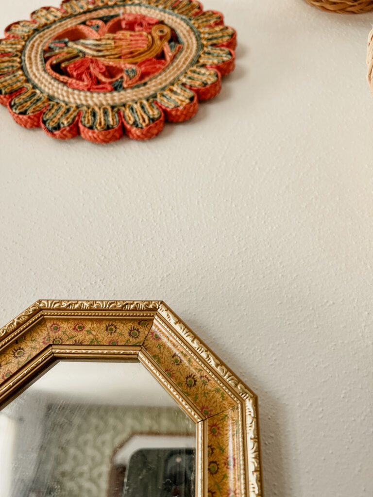 Gold framed mirror.